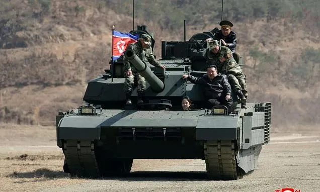 North Korean leader, daughter try out new tank