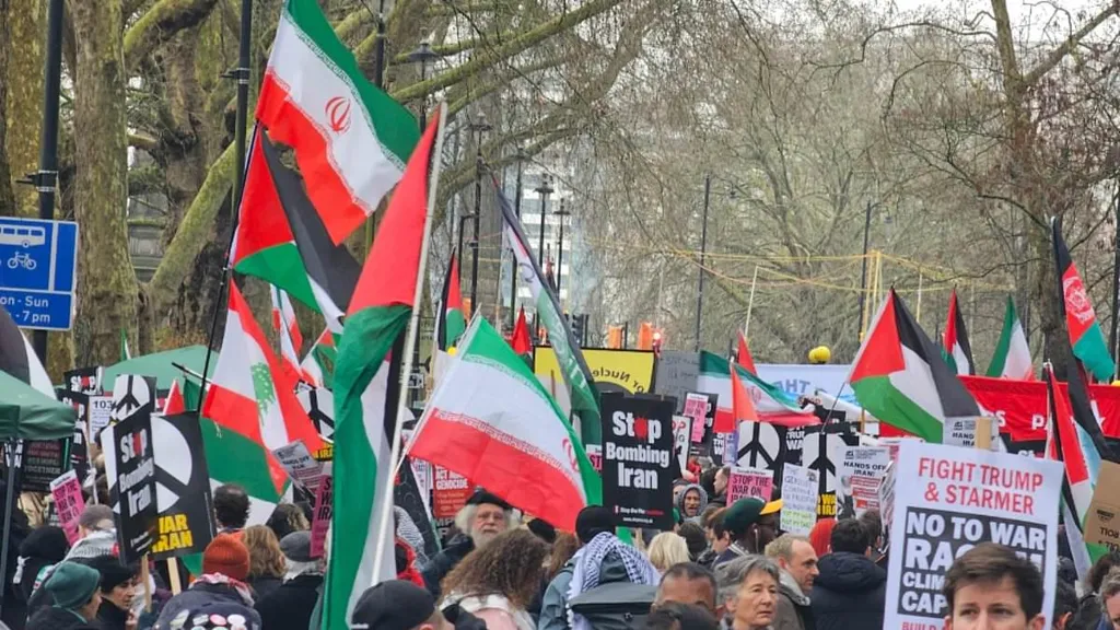 Leftist demonstrators chant 'victory to Iran' at march through London