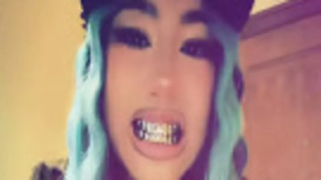 North West flaunts 14k white gold grillz amid finger piercing drama