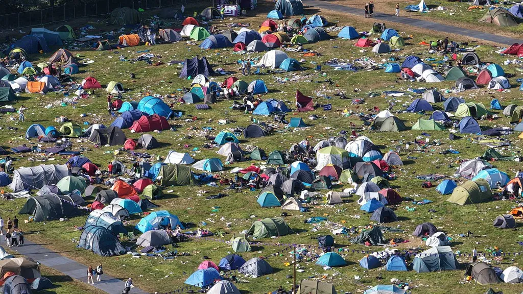 Snaps show aftermath of event with tents and rubbish littering fields