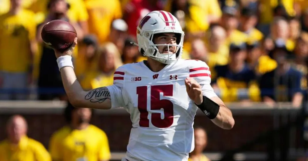 Who will be the quarterback is a big question ... for Iowa and Wisconsin's football teams