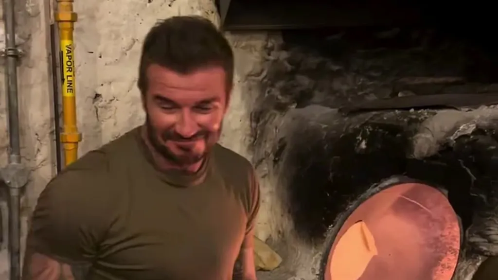 David Beckham shows son Brooklyn how it's done by cooking in Doha