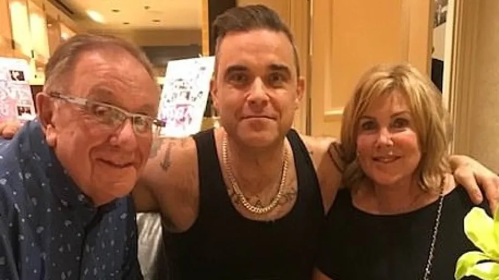 Robbie Williams admits he's not dealing with his parents' illnesses