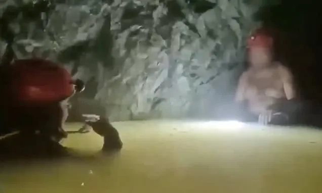 Miner is rescued from flooded cave 14 days after tunnel collapsed