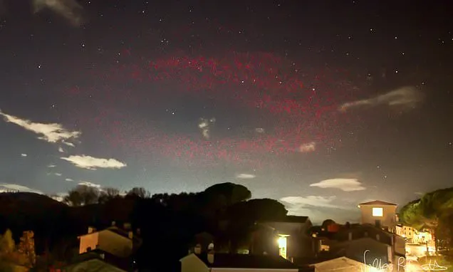 Scientists baffled as halo of red light appears over Italian town