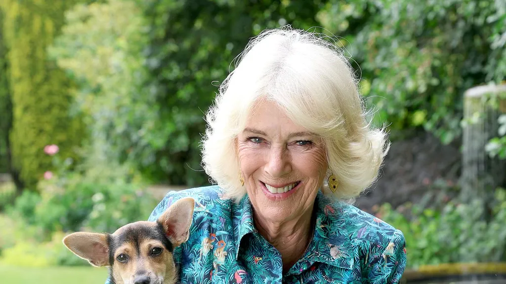Queen Camilla cuddles her rescue dog Moley in adorable unseen photo