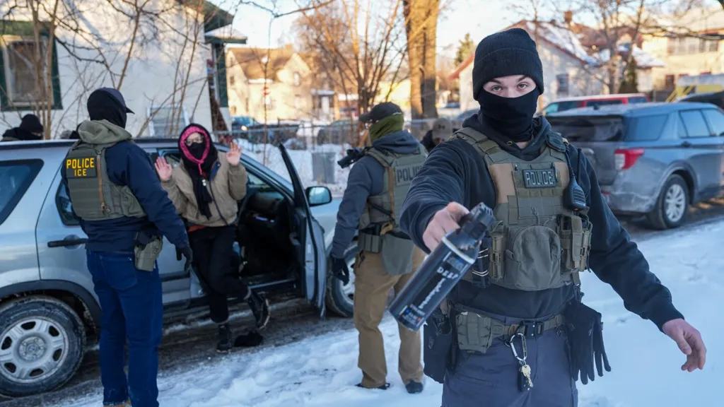 Immigration agents draw guns, arrest activists following them in Minneapolis
