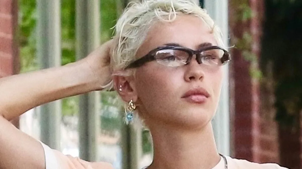Iris Law flashes her toned midriff during a stroll with a pal in NYC