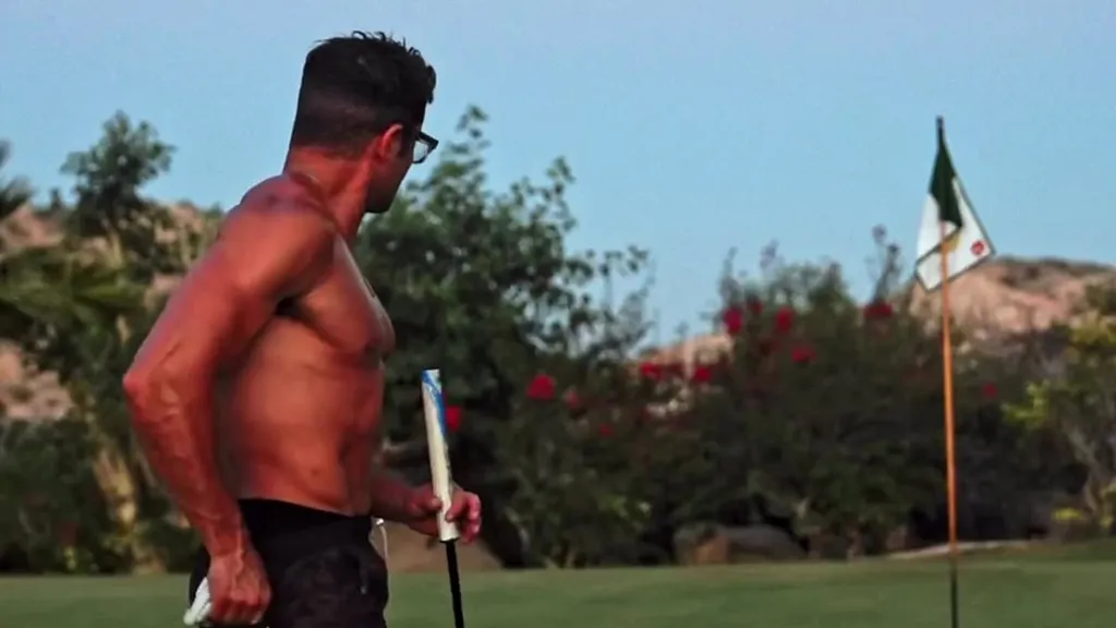 Shirtless Zac Efron shows off his muscular physique