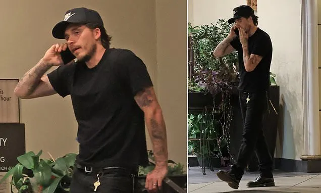 Brooklyn Beckham takes a tense phone call during outing in LA