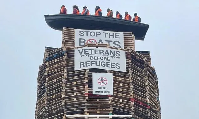Calls for removal of migrant effigies in boat placed on loyalist...