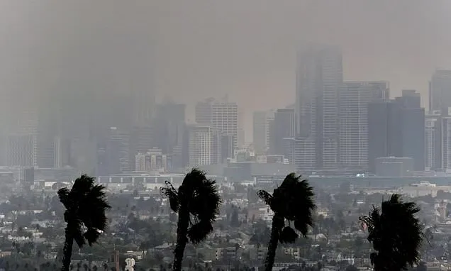 Monstrous wildfires blanket Southern California with smoky air,...