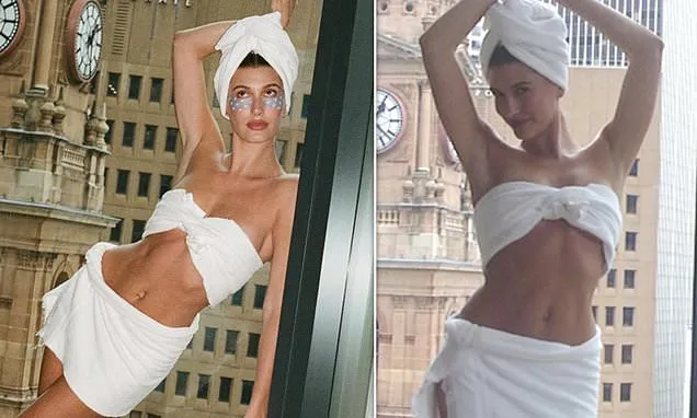 Hailey Bieber flaunts gym-honed abs in nothing but a white bath towel