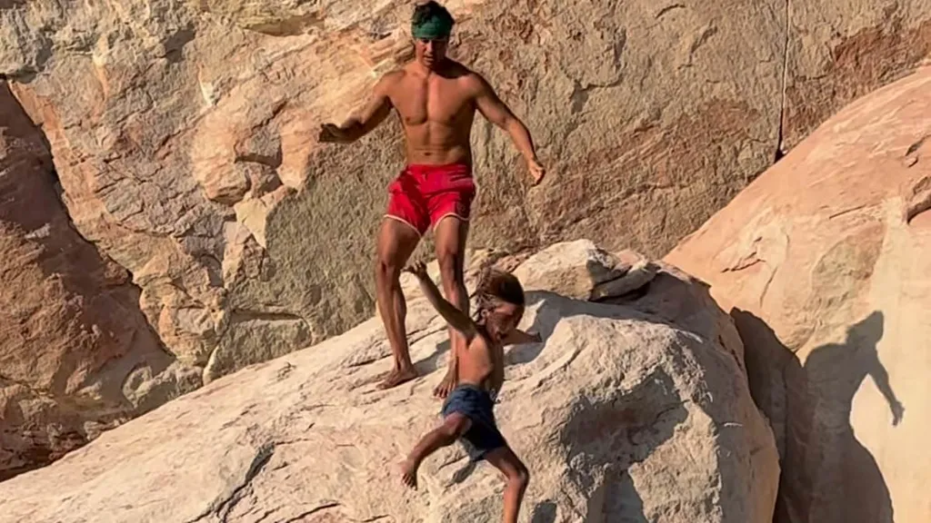Travel influencer sparks fury after throwing son off a cliff