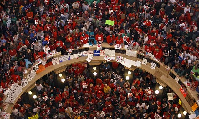 Unions score a major win in Wisconsin with a court ruling restoring...