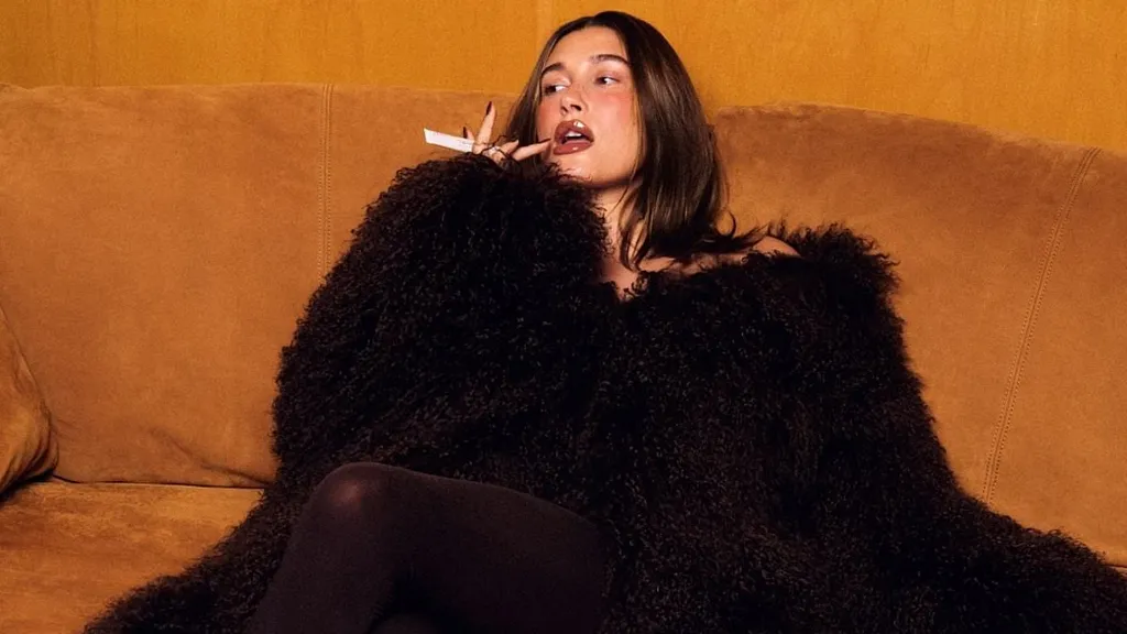 Hailey Bieber covers up in glam coat in chic Rhode campaign
