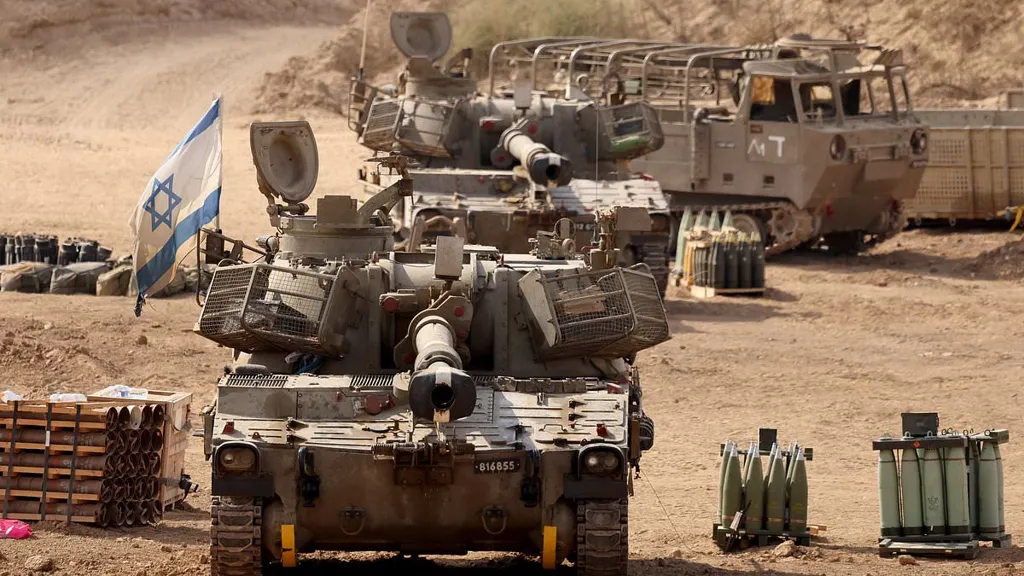IDF tanks level Gaza streets as 300,000 Palestinians flee