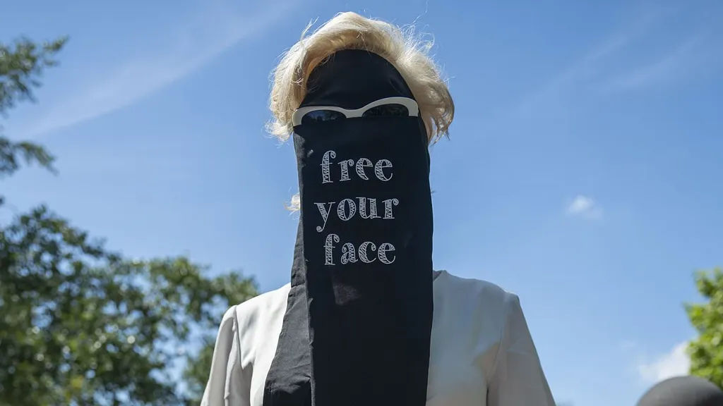 Women's rights campaigners dressed in veils declare 'free your face'