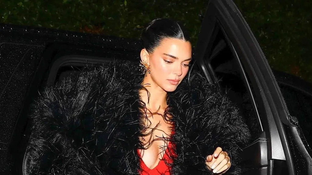 Kendall Jenner stuns in red sequin dress and fur coat on Christmas Eve