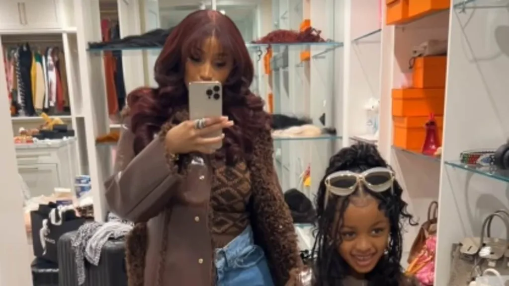 Cardi B and mini-me daughter, six, wear matching coats on Thanksgiving