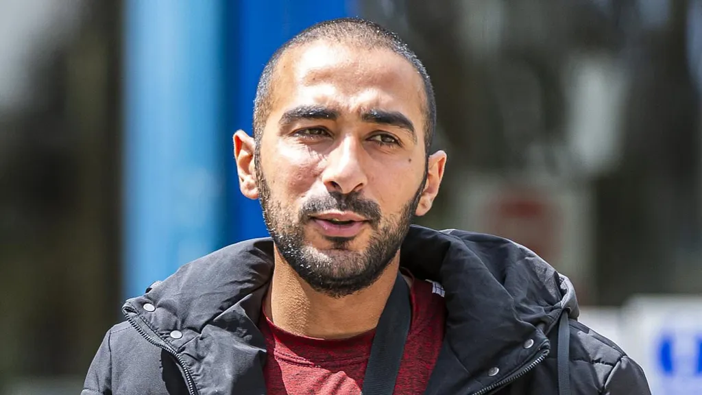 Manhunt for asylum seeker who brutally beat man after he flees court