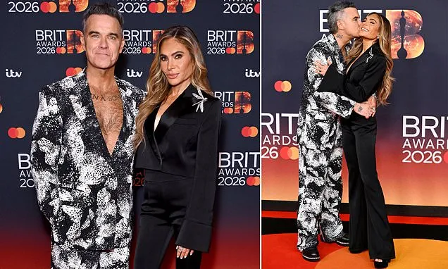 Robbie Williams cosies up to Ayda Field on the BRIT Awards red carpet