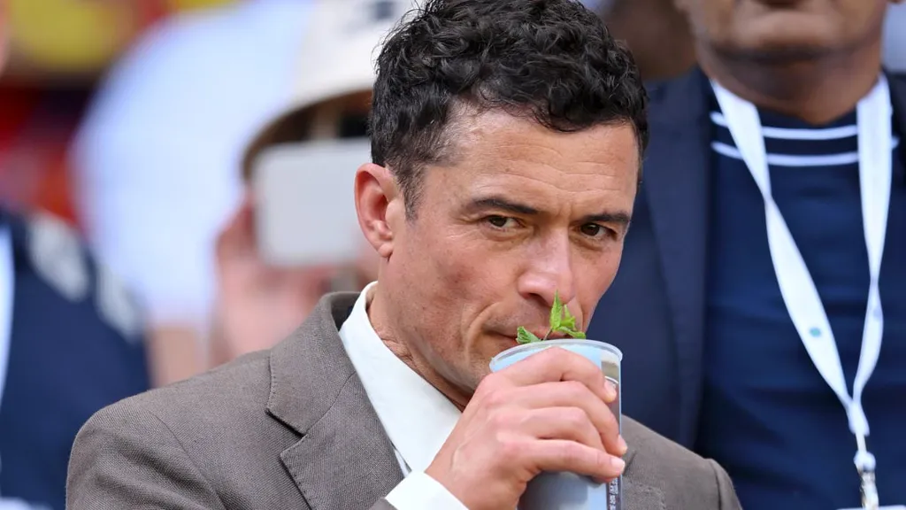 Weary-eyed Orlando Bloom attends Wimbledon - after boozy Oasis gig