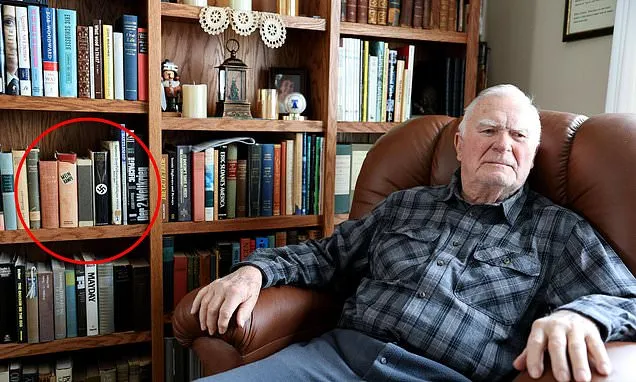 Accused Nazi opens his door after his basement disturbed quaint suburb