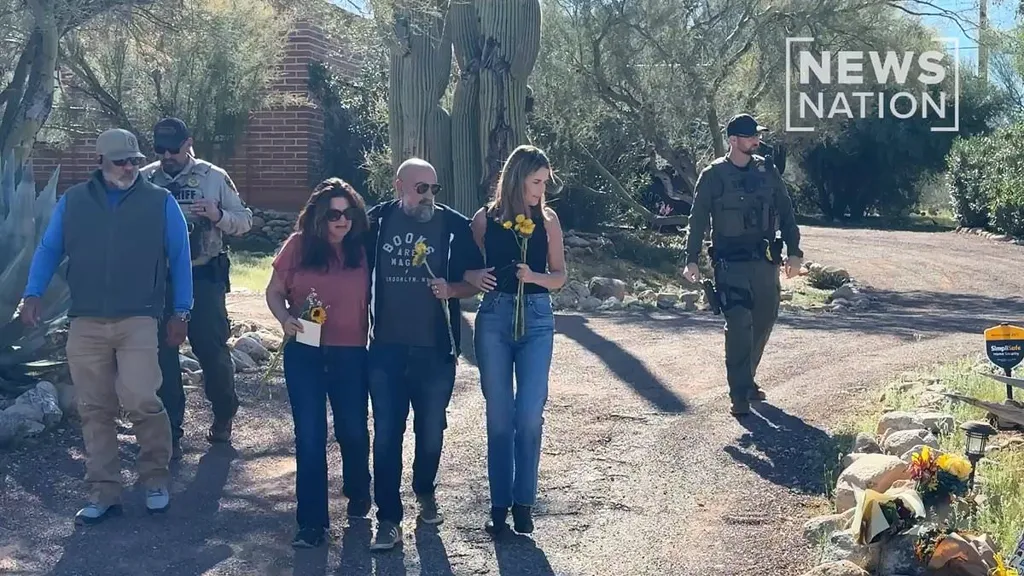 Savannah Guthrie lays flowers outside missing mother Nancy's home