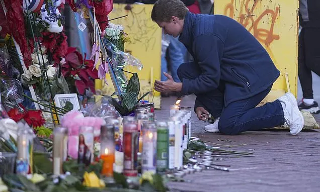 New Orleans mourns victims of truck attack with tearful vigil and...