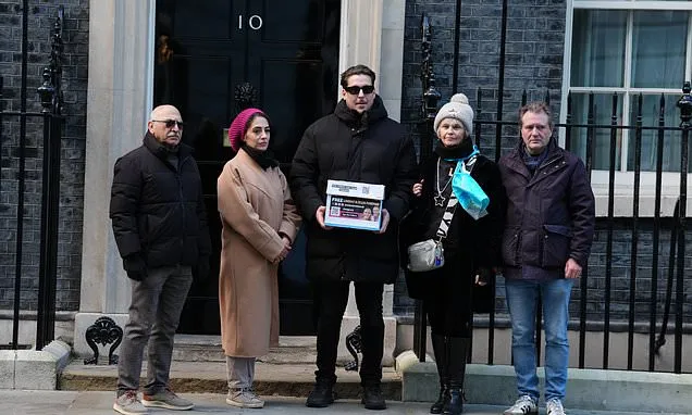 Family of UK couple detained in Iran and supporters hand petition...