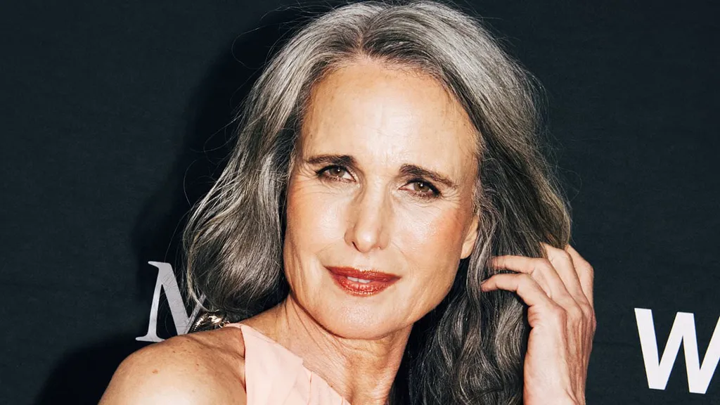 Andie MacDowell looks effortlessly chic in a peach maxi dress