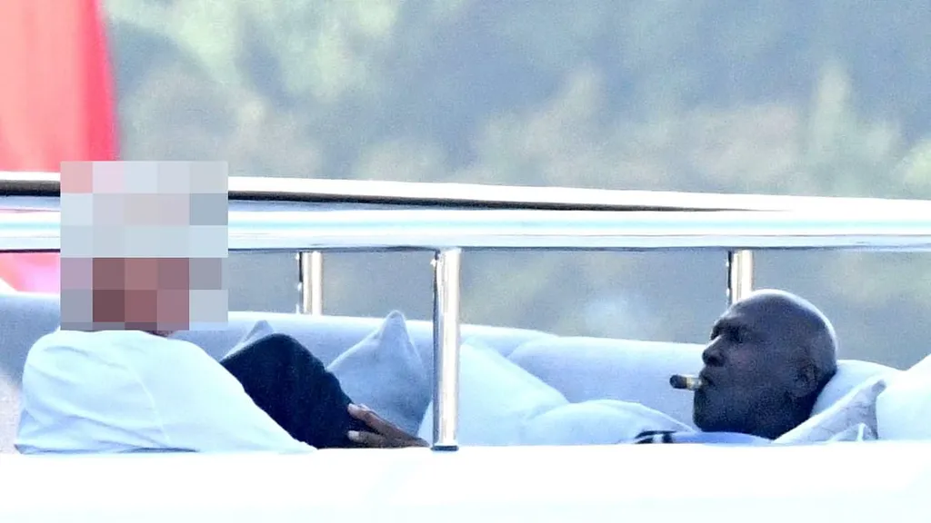Michael Jordan puffs cigar with confidant on $115m superyacht
