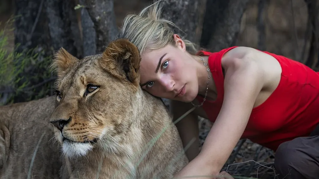Nepo baby is spitting image of her mother as she cuddles lion