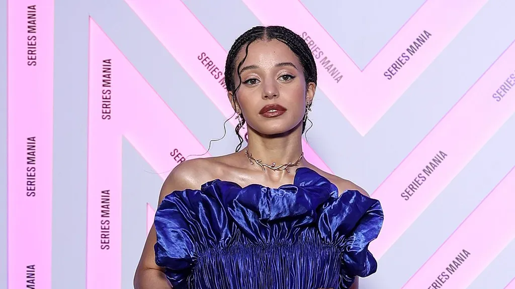 Chase Infiniti stuns in a dramatic blue ruffled gown at Festival