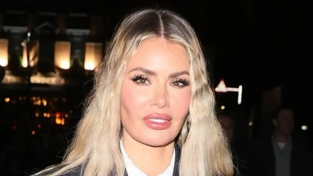 Chloe Sims stuns in a blue pinstripe blazer and black leather skirt