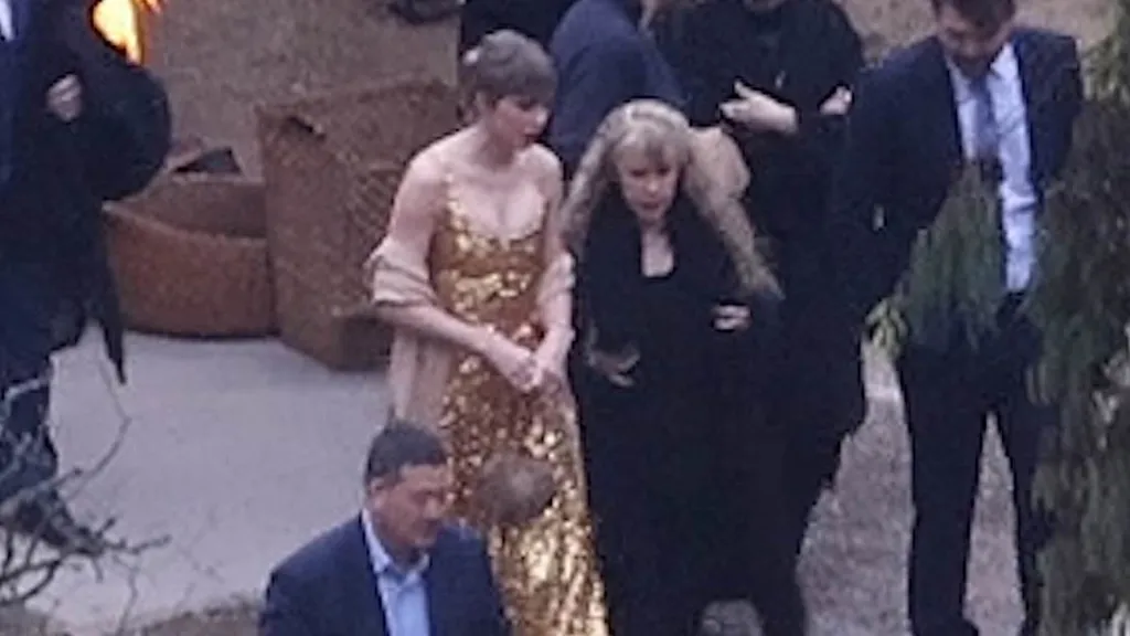Taylor Swift steals spotlight at BFF's wedding in gold metallic gown