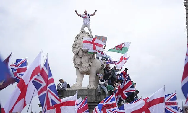 Thousands march in London in support of far-right activist Tommy...