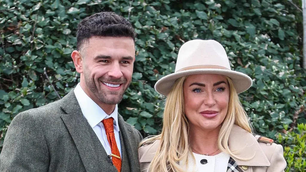 Josie Gibson cosies up to 'world's hottest horse farrier' at the races