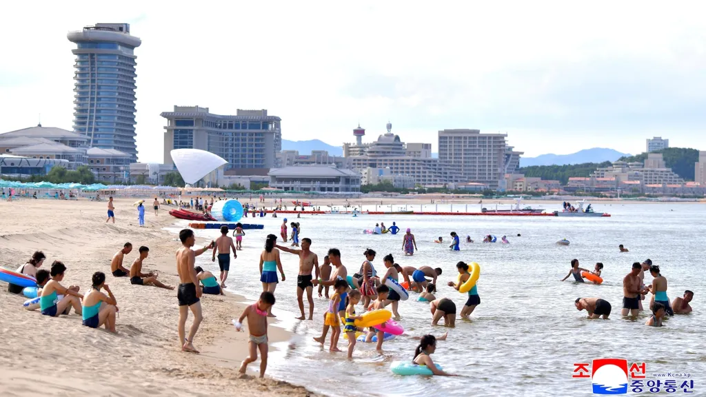 North Koreans swim and play at a beach resort touted as a boost for tourism