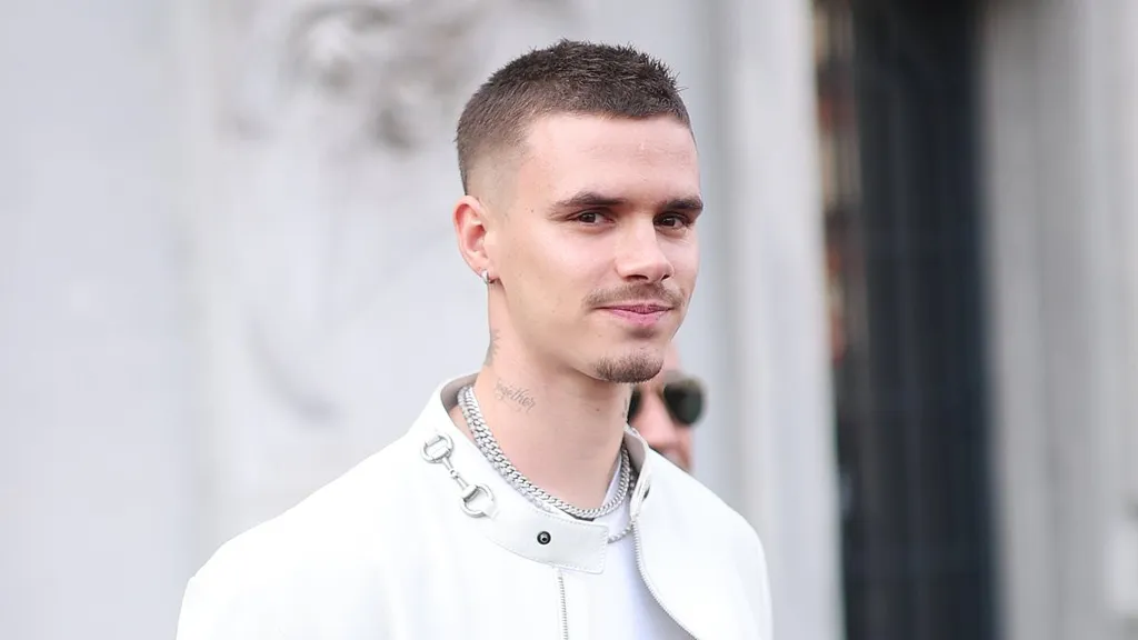Romeo Beckham, 23, steps out in all white for Gucci's show in Milan