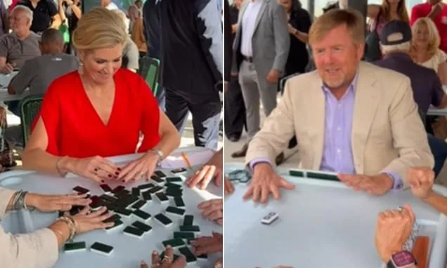 Ruling the table! Dutch Queen Maxima plays dominoes