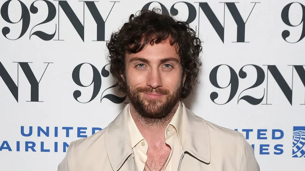 Aaron Taylor-Johnson flashes his hairy chest at 28 Years Later event