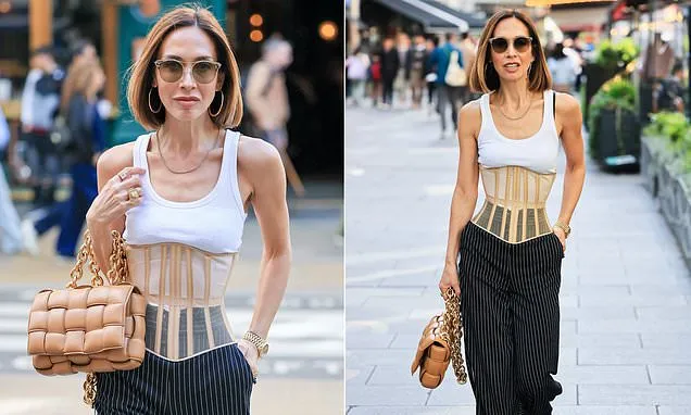 Myleene Klass displays her very lithe physique in a corset top