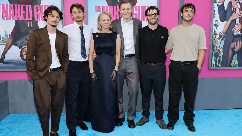 Pamela Anderson and Liam Neeson joined by sons at Naked Gun premiere