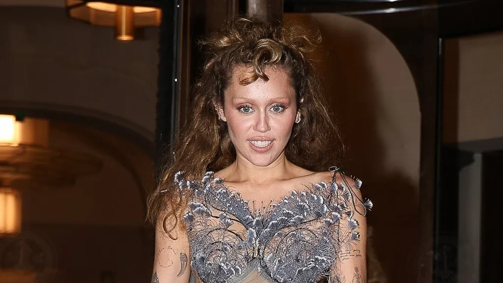 Miley Cyrus goes braless in an ethereal sheer gown in Paris