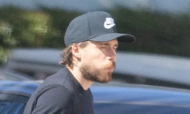 Brooklyn Beckham cuts a solitary figure as he dines alone