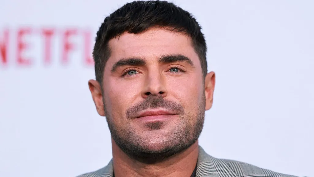 Zac Efron's shirtless golf groove is the perfect 'Stick' TV theme song: Hear it now