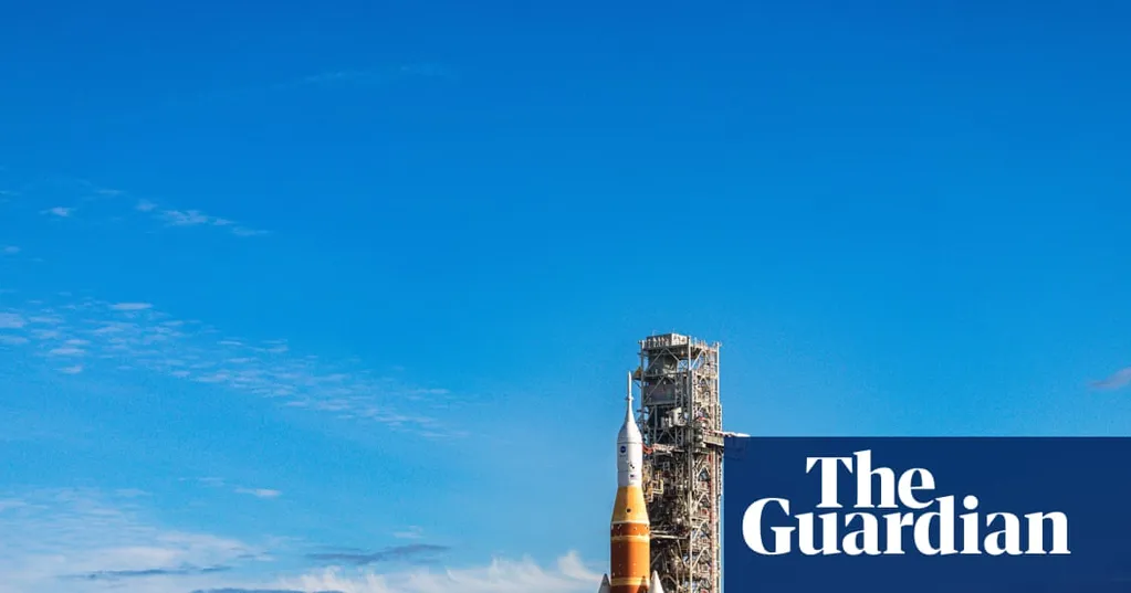 Nasa moon rocket creeps to its launch pad in preparation for astronaut flight