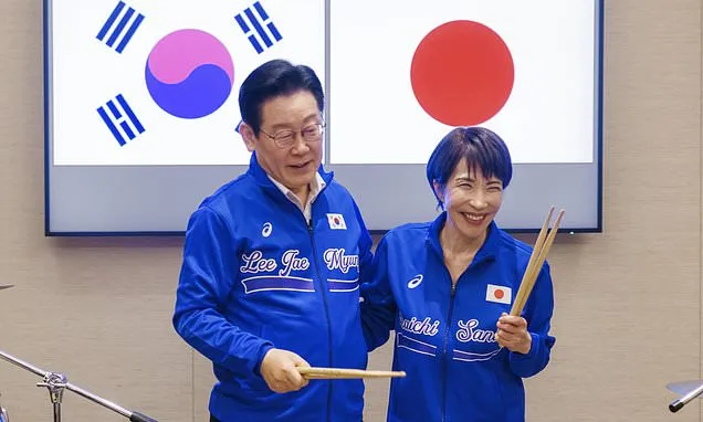 Japanese and South Korean leaders jam to K-pop hits at a summit